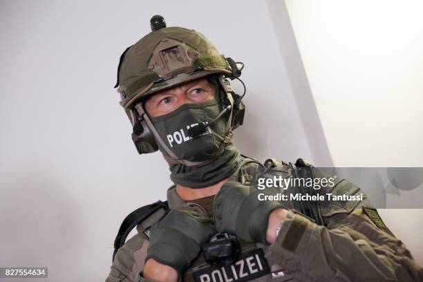 Officiers of the Police special forces or GSG9 stands during the opening of the new Headquarters on August 8, 2017 in Berlin. Starting from August...