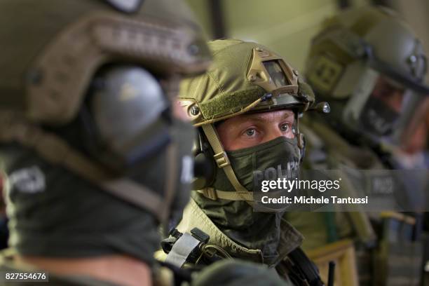 Officiers of the Police special forces or GSG9 stand during the opening of the new Headquarters on August 8, 2017 in Berlin. Starting from August all...