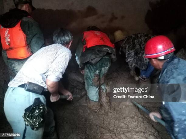 Rescue operation in progress after a landslide in Gengdi village on August 08, 2017 in Puge, China. A landslide destroyed 71 rooms in the villiage in...