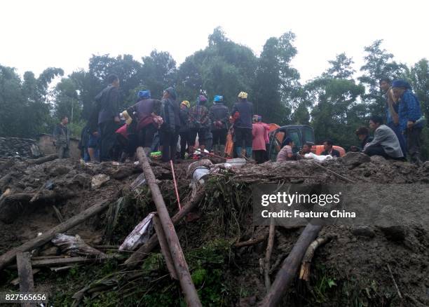 Rescue operation in progress after a landslide in Gengdi village on August 08, 2017 in Puge, China. A landslide destroyed 71 rooms in the villiage in...