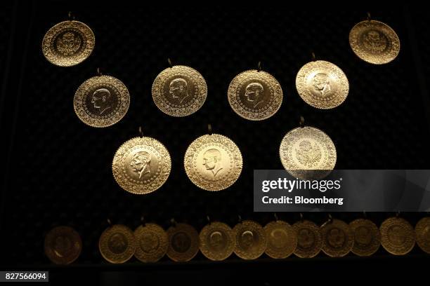 Commemorative gold coins bearing the image of Kemal Ataturk, founder of the Turkish republic, sit on display in a gold store in the Grand Bazaar...