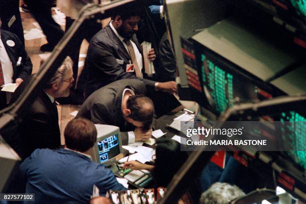 Trader on the New York Stock Exchange reacts on October 19, 1987 as stocks are devastated during one of the most frantic days in the exchange's...
