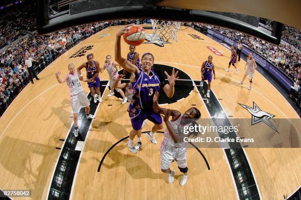 Candace Parker of the Los Angeles Sparks lays up a shot against Sophia Young of the San Antonio Silver Stars during the WNBA game on September 5,...