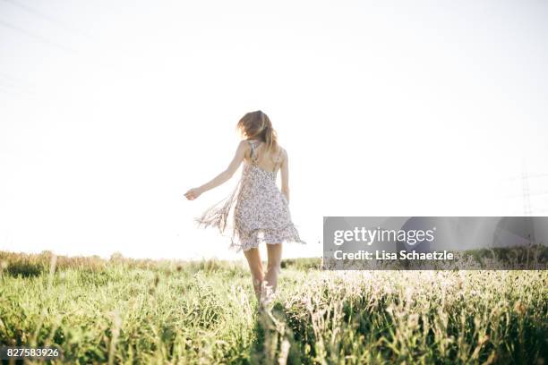 woman wearing a dress enjoys nature and freedom - sommerkleid stock-fotos und bilder