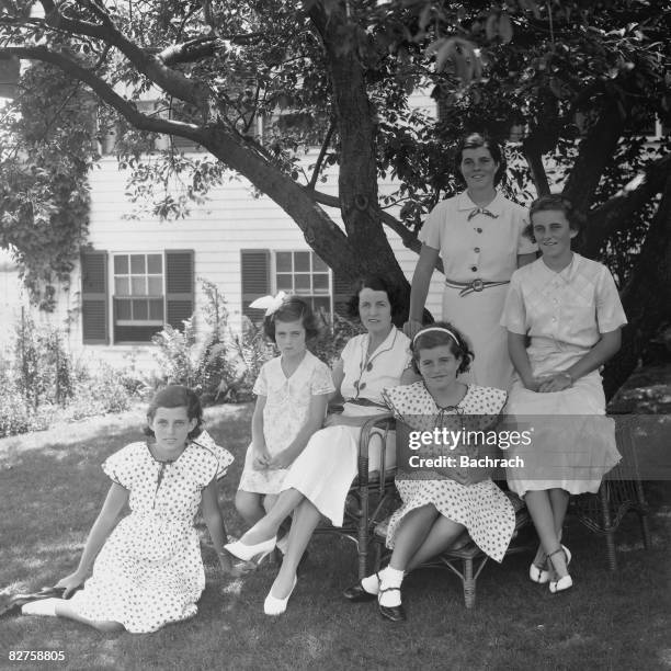 Portrait of American socialite and philanthropist Rose Kennedy as she poses with her daughters, from left, Eunice Kennedy, Jean Kennedy, Patricia...