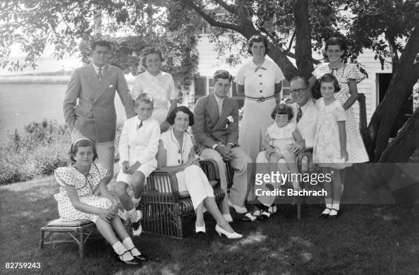 Portrait of the Kennedy family as they sit in the shade of some trees, Hyannis, Massachussetts, 1930s. Seated from left are: Patricia Kennedy ,...