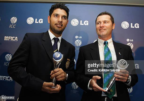 India Yuvraj Singh poses with Australia's Simon Taufel at the International Cricket Council Awards ceremony in the Gulf emirate of Dubai on September...