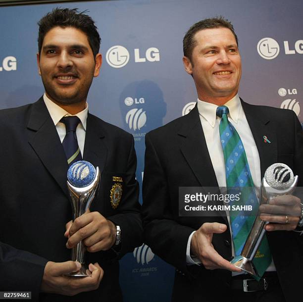 India Yuvraj Singh poses with Australia's Simon Taufel at the International Cricket Council Awards ceremony in the Gulf emirate of Dubai on September...