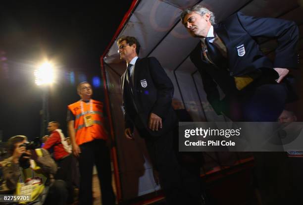 England Manager Fabio Capello and Assistant Franco Baldini walk out on to the pitch prior to the FIFA 2010 World Cup Qualifying Group Six match...