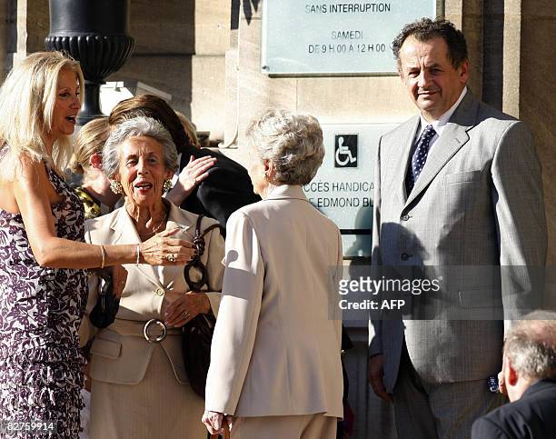 Andree Sarkozy , French President Nicolas Sarkozy's mother, waits in front of the city hall next to Guillaume Sarkozy, Nicolas Sarkozy's brother, in...