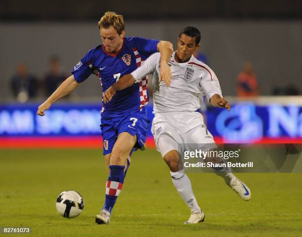 Theo Walcott of England fights for the ball with Ivan Rakitic of Croatia during the FIFA 2010 World Cup Qualifying Group Six match between Croatia...