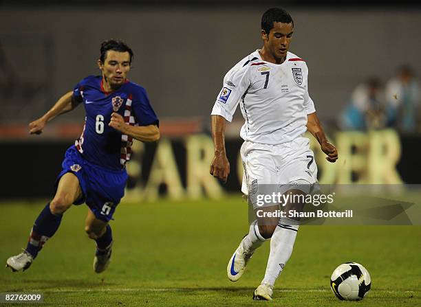 Theo Walcott of England breaks clear to score his hat trick and England's fourth goal during the FIFA 2010 World Cup Qualifying Group Six match...