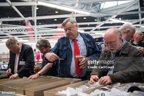 Beer mat collectors browse mats for sale at the CAMRA Great British Beer festival at Olympia exhibition centre on August 8, 2017 in London, England....