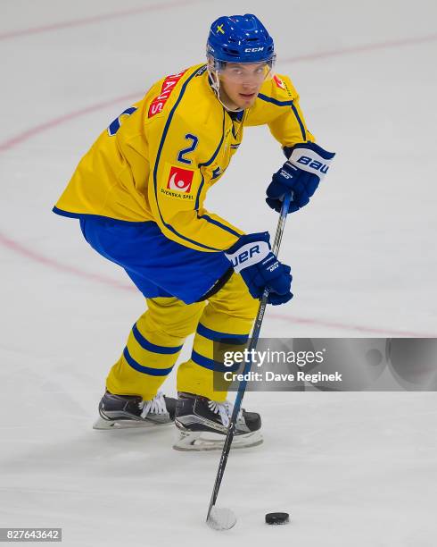 Timothy Liljegren of Sweden skates up ice with the puck against USA during a World Jr. Summer Showcase game at USA Hockey Arena on August 2, 2017 in...