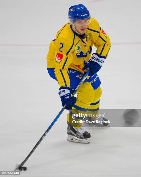 Timothy Liljegren of Sweden skates up ice with the puck against USA during a World Jr. Summer Showcase game at USA Hockey Arena on August 2, 2017 in...