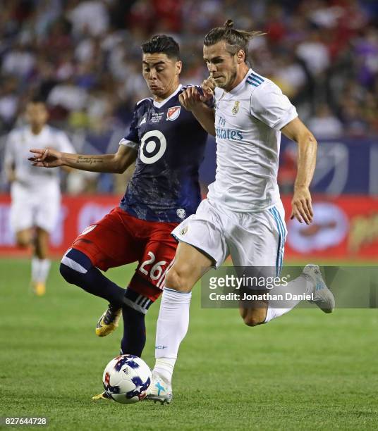 Gareth Bale of Real Madrid battles with Miguel Almiron of the MLS All-Stars during the 2017 MLS All- Star Game at Soldier Field on August 2, 2017 in...