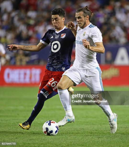 Gareth Bale of Real Madrid battles with Miguel Almiron of the MLS All-Stars during the 2017 MLS All- Star Game at Soldier Field on August 2, 2017 in...