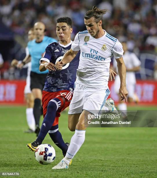 Gareth Bale of Real Madrid battles with Miguel Almiron of the MLS All-Stars during the 2017 MLS All- Star Game at Soldier Field on August 2, 2017 in...