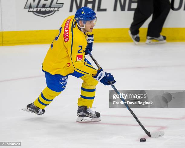 Timothy Liljegren of Sweden turns up ice with the puck against USA during a World Jr. Summer Showcase game at USA Hockey Arena on August 2, 2017 in...