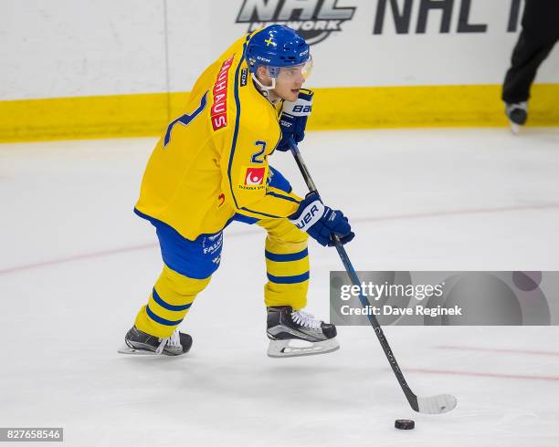 Timothy Liljegren of Sweden turns up ice with the puck against USA during a World Jr. Summer Showcase game at USA Hockey Arena on August 2, 2017 in...