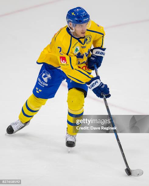 Timothy Liljegren of Sweden turns up ice with the puck against USA during a World Jr. Summer Showcase game at USA Hockey Arena on August 2, 2017 in...