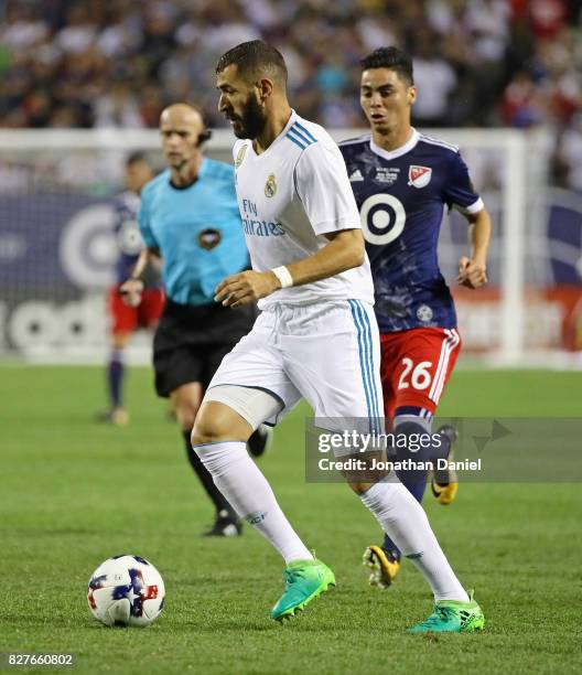 Karim Benzema of Real Madrid moves past Miguel Almiron of the MLS All-Stars during the 2017 MLS All- Star Game at Soldier Field on August 2, 2017 in...