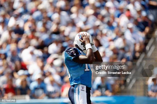 Vince Young of the Tennessee Titans puts his hands on his helmet during the game against the Jacksonville Jaguars at LP Field in Nashville, Tennessee...