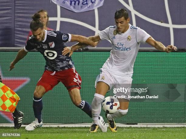 Graham Zusi of the MLS All-Stars battles for the ball with Theo Hernandez of Real Madrid during the 2017 MLS All- Star Game at Soldier Field on...