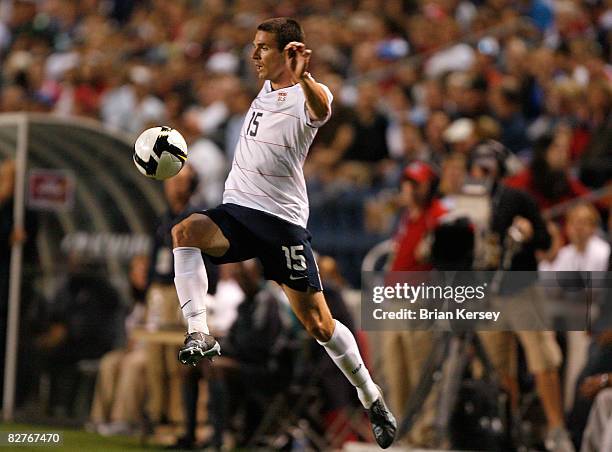 Defender Heath Pearce of the United States kicks the ball against Trinidad & Tobago during the first half at Toyota Park on September 10, 2008 in...