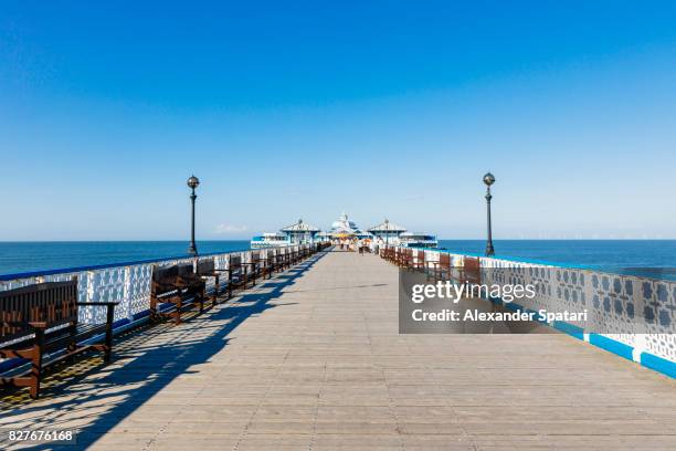 llandudno pier on a clear sunny day, llandudno, north wales, uk - llandudno stock pictures, royalty-free photos & images