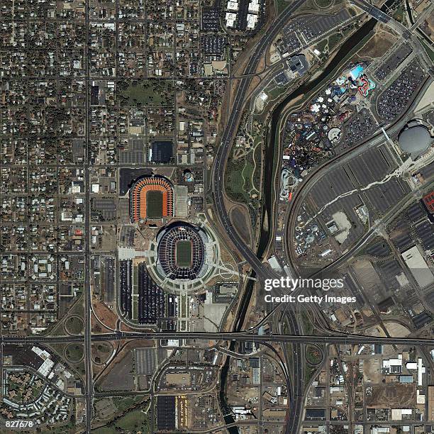 This image captured by a satellite on August 9, 2001 shows Invesco Field and Mile High Stadium in Denver, CO from an orbit of 423 miles above Earth....