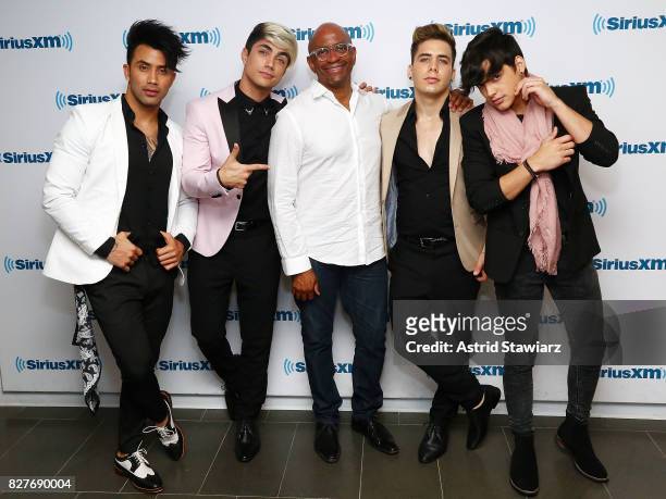 Singers Angel Rodriguez Quintero, Sian Chiong, producer Sergio George, Mikel Korta Torres and Hansel Delgado of the latin boy band Angeles visit the...