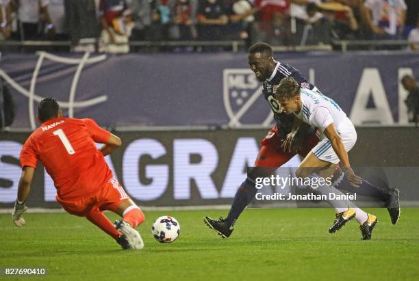 Jozy Altidore of the MLA All-Stars gets off a shot under pressure from Marcos Liorente of Real Madrid as Keylor Navas moves in for the save during...