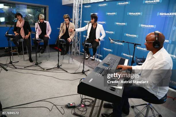 Singers Hansel Delgado, Sian Chiong, Mikel Korta Torres and Angel Rodriguez Quintero of the latin boy band Angeles perform with producer Sergio...