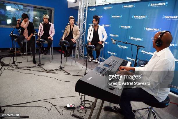 Singers Hansel Delgado, Sian Chiong, Mikel Korta Torres and Angel Rodriguez Quintero of the latin boy band Angeles perform with producer Sergio...