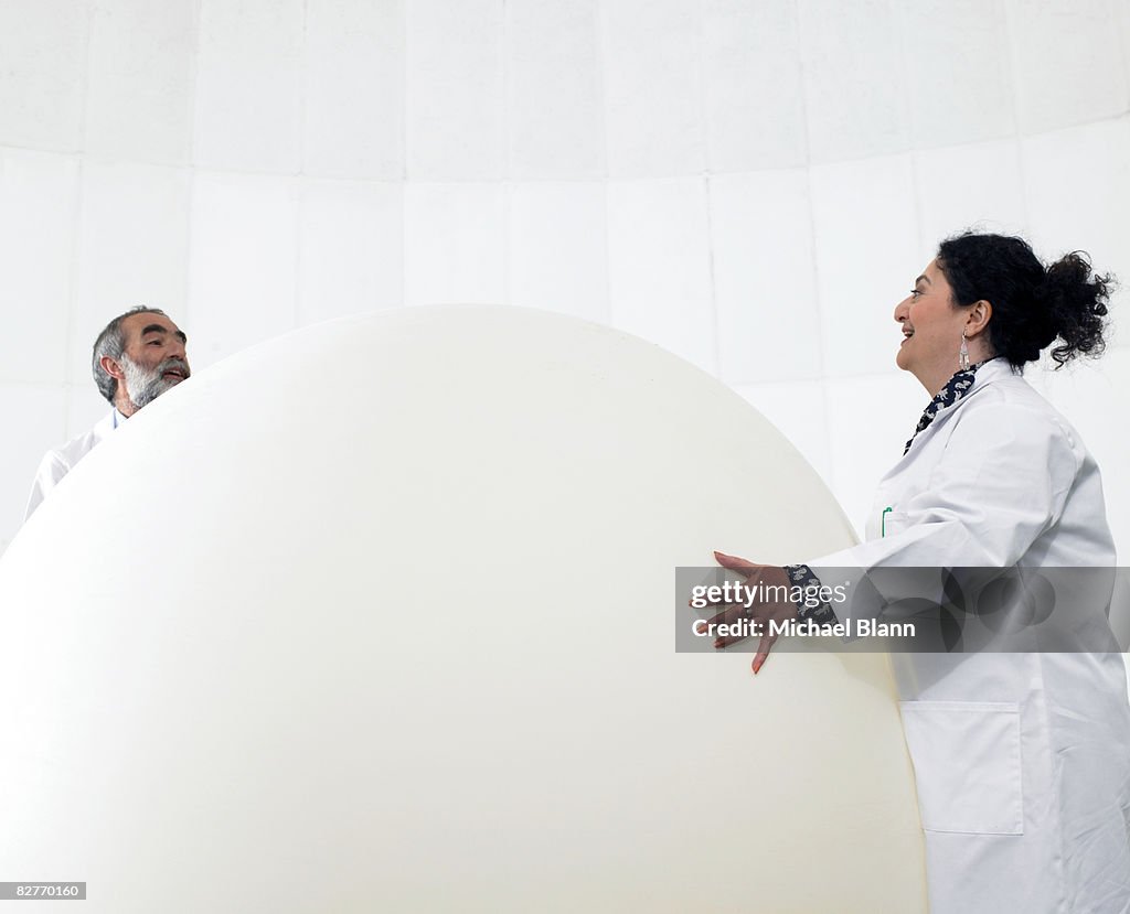 Scientist standing with weather balloon