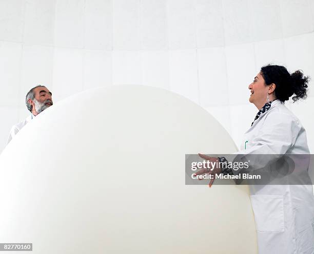 scientist standing with weather balloon - weather balloon stock pictures, royalty-free photos & images