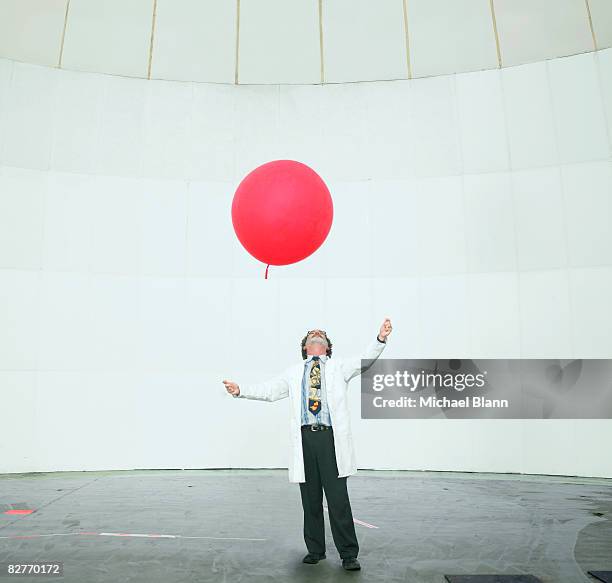 scientist looking up at weather balloon - weather balloon stock pictures, royalty-free photos & images