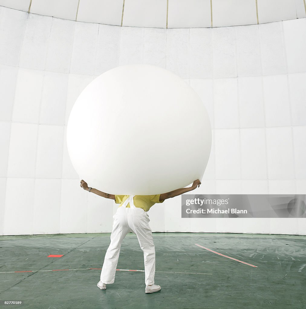 Man with weight on shoulders