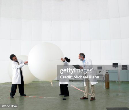 Scientists recording data in laboratory