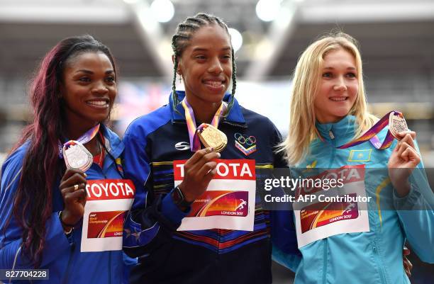 Silver medallist Colombia's Caterine Ibarguen , gold medallist Venezuela's Yulimar Rojas and bronze medallist Kazakhstan's Olga Rypakova pose on the...