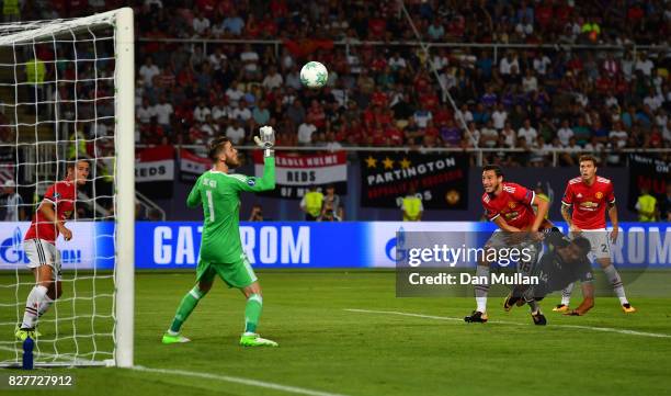 Casemiro of Real Madrid heads towards goal as David De Gea of Manchester United attempts to save during the UEFA Super Cup final between Real Madrid...