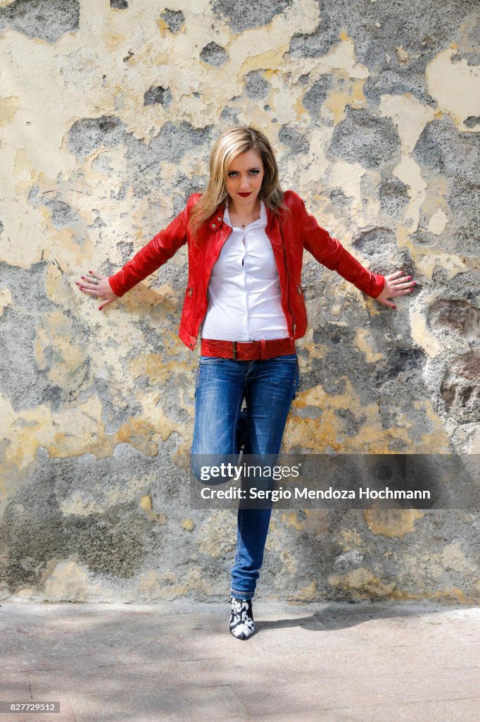 A beautiful blonde woman looking stylish in front of a grungy wall - Mexico City, Mexico