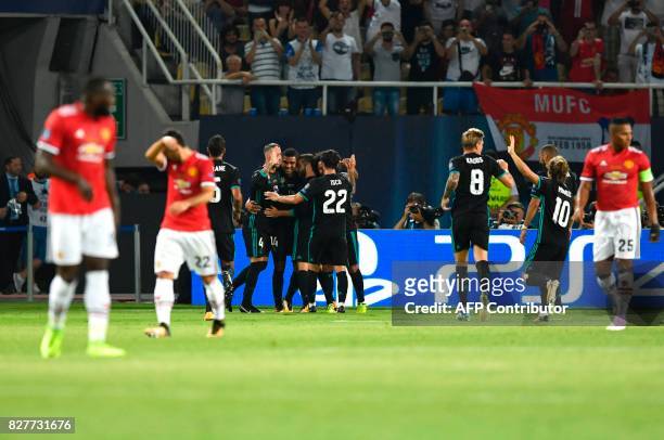 Madrid players celebrate after scoring a goal during the UEFA Super Cup football match between Real Madrid and Manchester United on August 8 at the...
