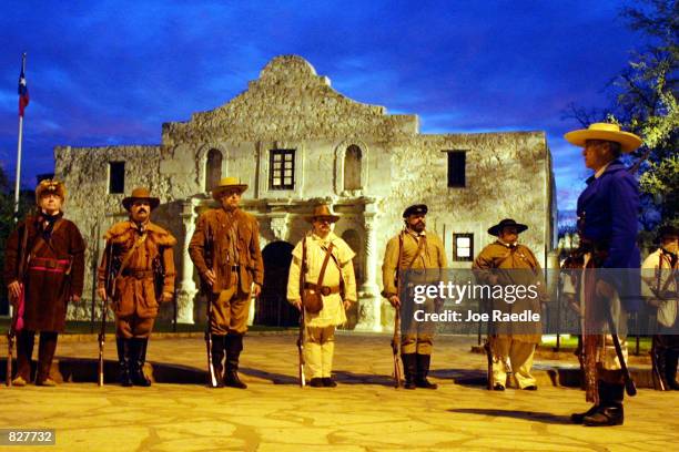 Actors, portraying defenders of the Alamo, stand in front of the structure during a re-enactment of the fall of the Alamo, March 6 to Mexican forces...