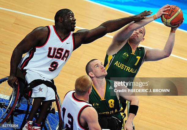 Australia's Shaun Norris looks to shoot under pressure from Matt Scott of the US as Michael Hartnett and Jeremy Lade guard in their men's wheelchair...