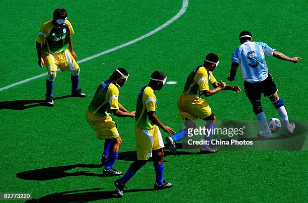 Silvio Velo of Argentina competes in the Five-A-Side Football match between Argentina and Brazil at Olympic Green Hockey Field B during day five of...