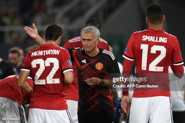 Manchester United's Portuguese manager Jose Mourinho gives his instructions to Manchester United's Armenian midfielder Henrikh Mkhitaryan during the...