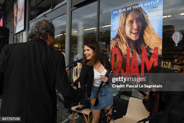 Daphne Patakia and Tony Gatlif attend the Paris Premiere of the film "Djam" on August 8, 2017 in Paris, France.