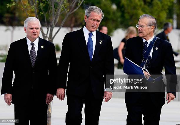 President George W. Bush walks with former U.S. Secretary of Defense Donald Rumsfeld and U.S. Secretary of Defense Robert Gates during the Pentagon...